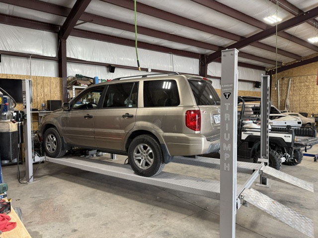 Honda Pilot on lift at 310 Auto Techs
